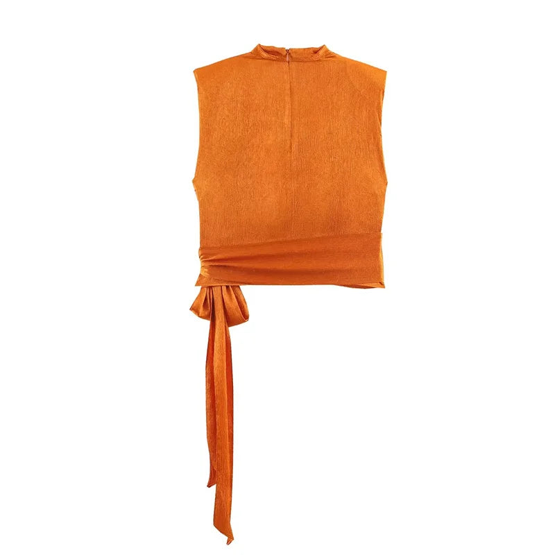 Top para mujer, novedad de primavera 2026: diseño naranja sin mangas con textura satinada y lazo largo; una prenda elegante, estilosa y única que marca tendencia.
