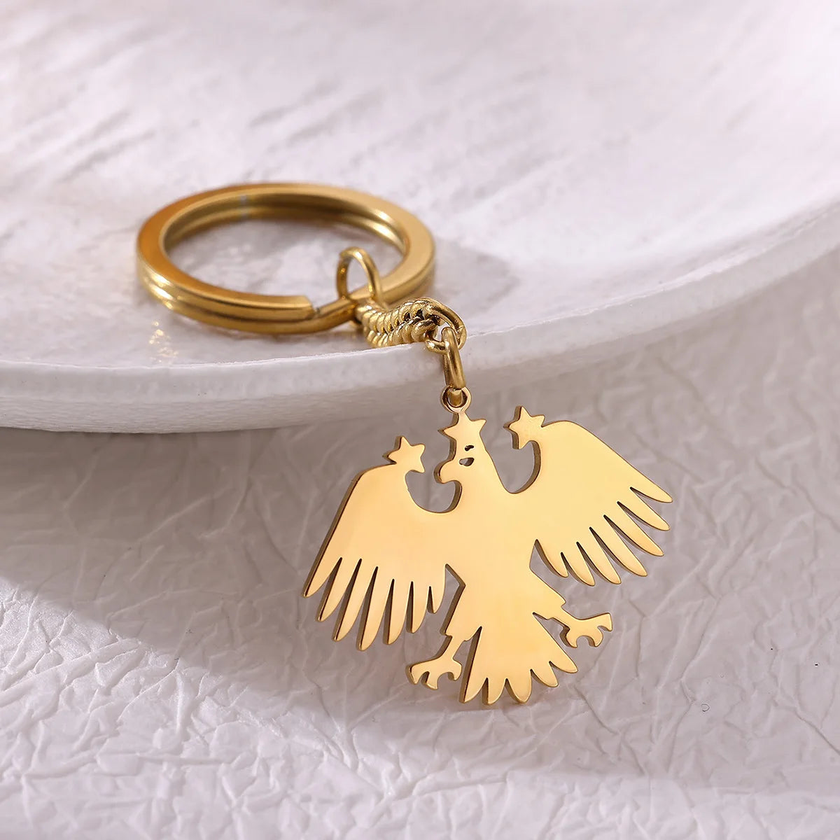 Llavero Águila & Estrellas en Acero Inoxidable Dorado – Accesorio Elegante para Mujer