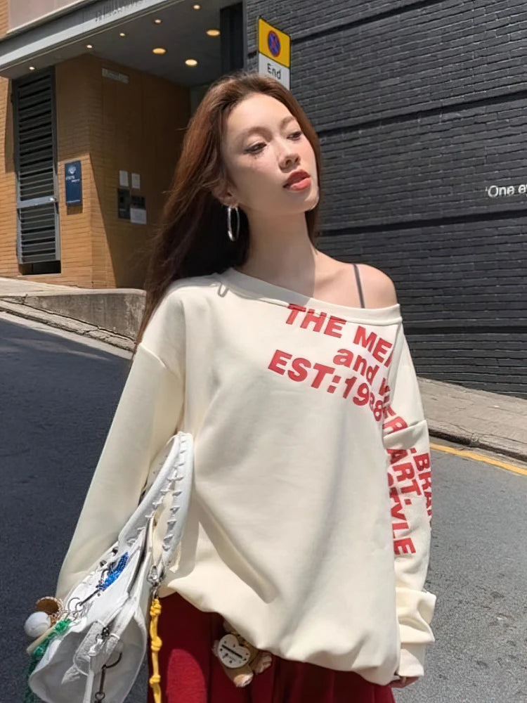 Sudadera estilo Y2K para mujer: oversize, estilo urbano, manga larga, un solo hombro, estampado TXT, moda coreana, ideal para otoño e invierno.