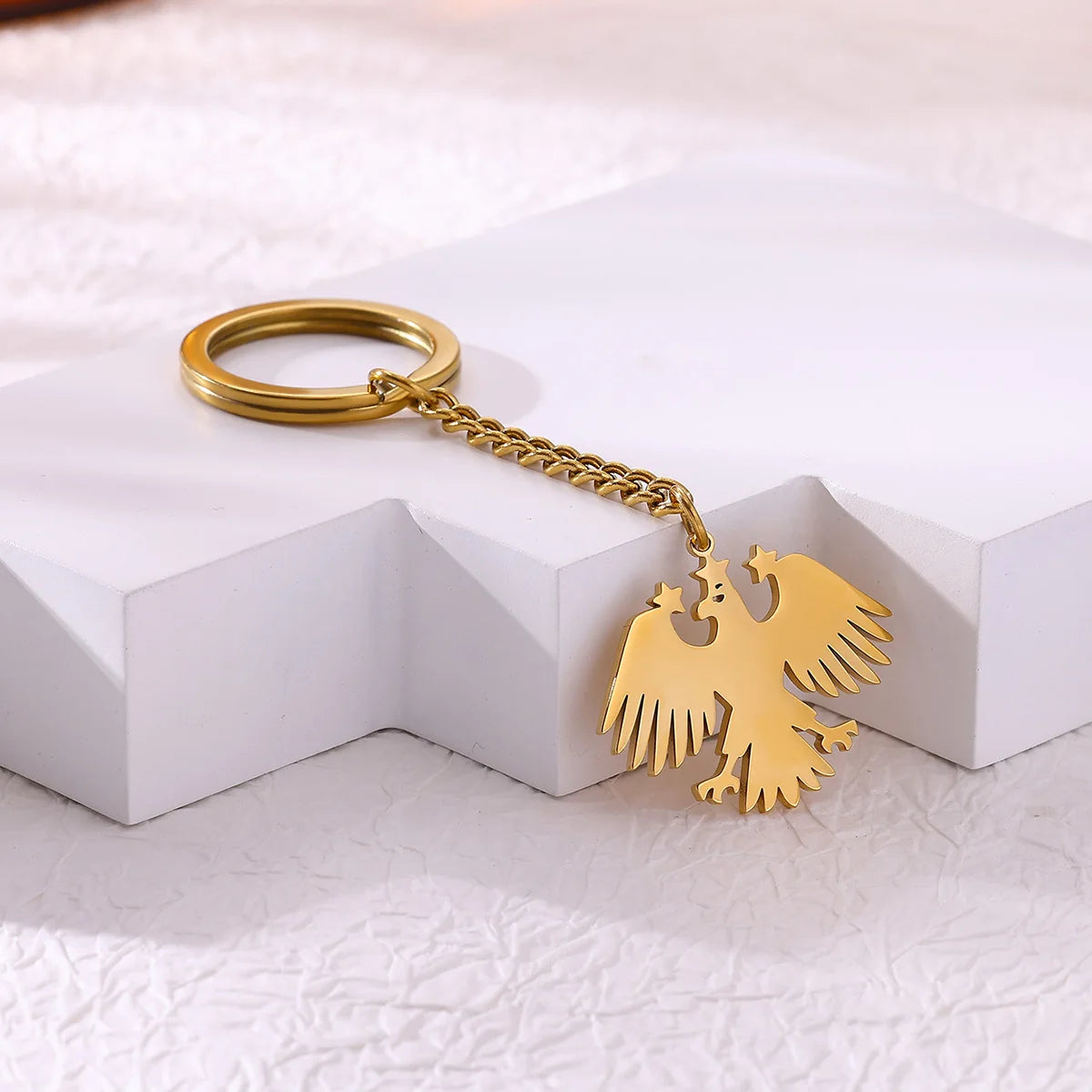 Llavero Águila & Estrellas en Acero Inoxidable Dorado – Accesorio Elegante para Mujer