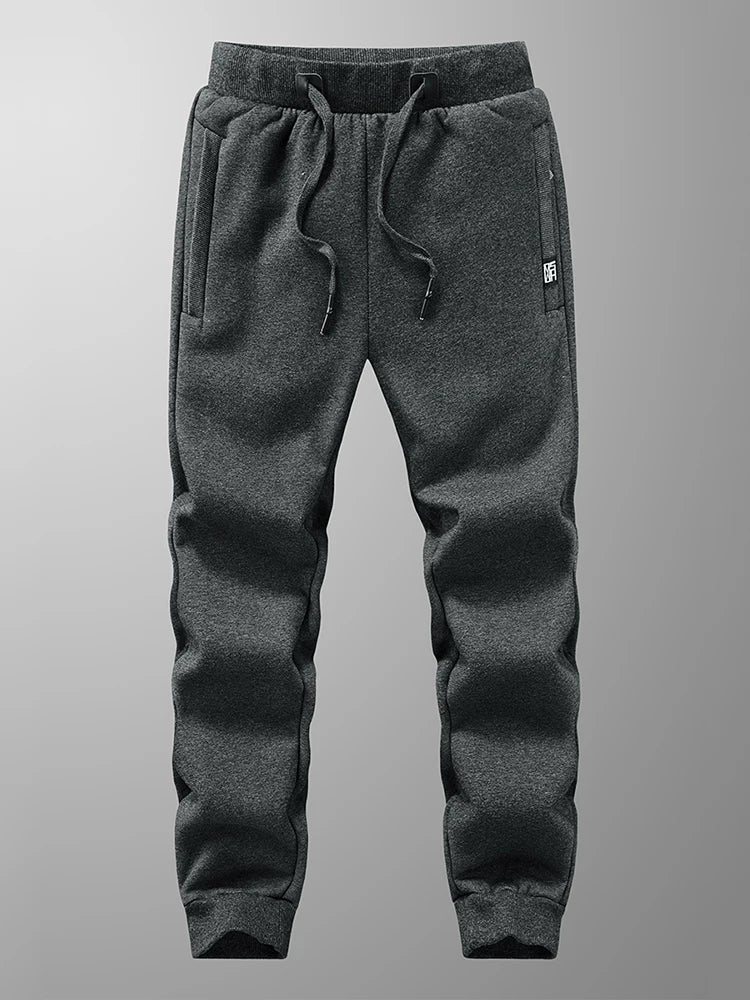 Pantalones de chándal para hombre de invierno: joggers gruesos y cálidos de felpa, ropa deportiva casual de algodón con bolsillos con cremallera y tallas grandes (6XL, 7XL, 8XL).