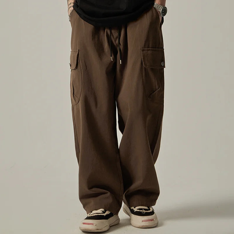 Pantalones cargo para hombre (primavera/otoño 2025): estilo vintage japonés, corte recto y holgado de pernera ancha, con botones, bolsillos grandes y cintura con cordón.