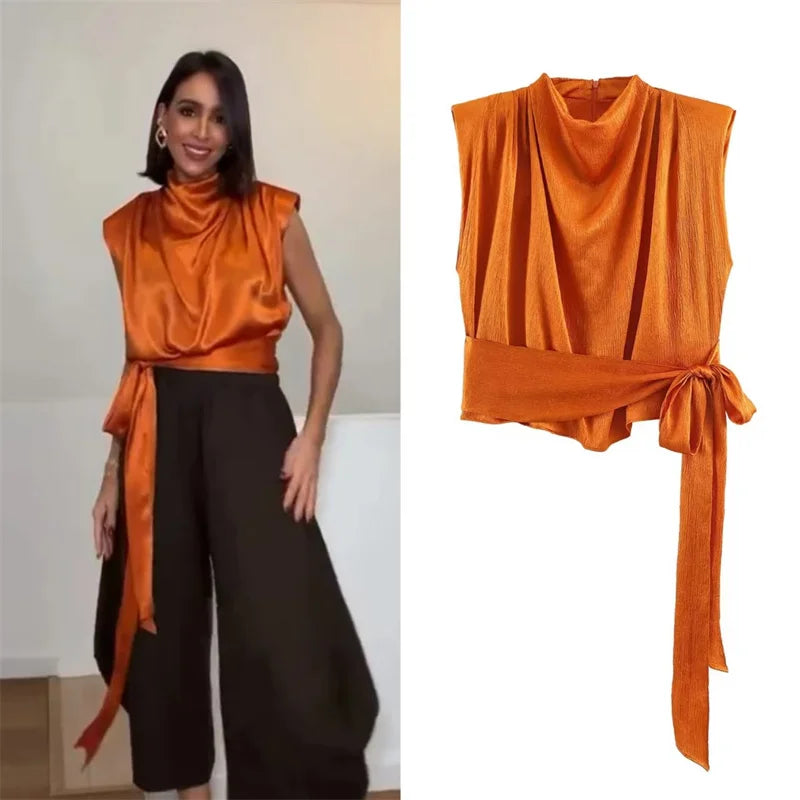 Top para mujer, novedad de primavera 2026: diseño naranja sin mangas con textura satinada y lazo largo; una prenda elegante, estilosa y única que marca tendencia.